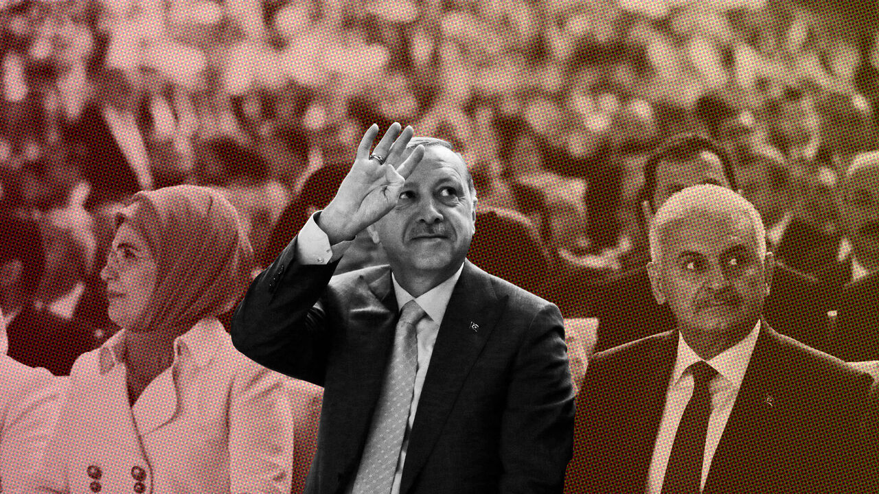 TURKEY-POLITICS/ Turkey's President Recep Tayyip Erdogan, accompanied by his wife Emine, and Turkey's Prime Minister Binali Yildirim, waves to supporters during the congress of the ruling Justice and Development Party (AKP) in Ankara, Turkey, May 21, 2017. REUTERS/Burhan Ozbilici/Pool - RC17D13F7BD0