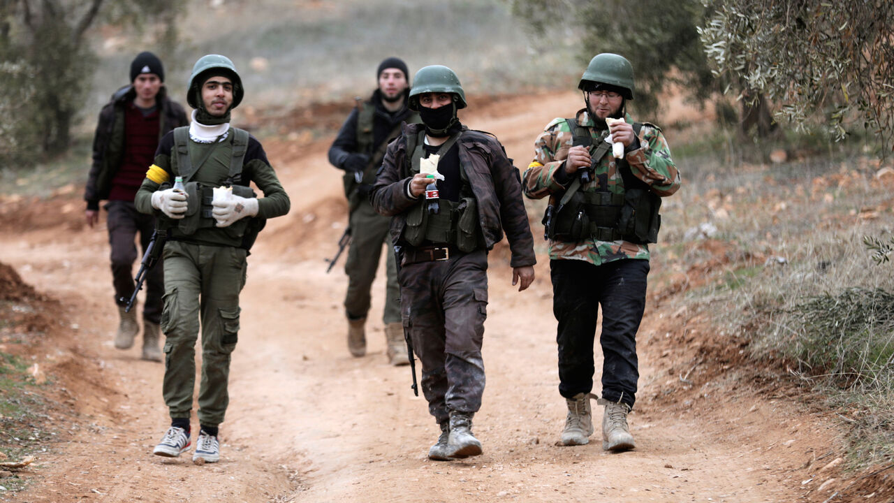 MIDEAST-CRISIS/SYRIA-TURKEY Turkish-backed Free Syrian Army fighters are seen near Mount Barsaya, northeast of Afrin, Syria January 22, 2018. REUTERS/Khalil Ashawi - RC1E2E017CA0