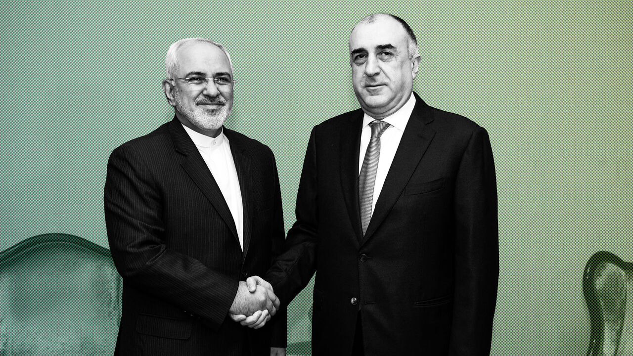 AFP_VB4DI Azerbaijan's Foreign Minister Elmar Mammadyarov (R) meets with his Iranian counterpart Mohammad Javad Zarif in Baku on December 20, 2017.
Foreign Ministers of Azerbaijan, Iran and Turkey hold the fifth trilateral meeting in Baku. / AFP PHOTO / Tofik BABAYEV (Photo credit should read TOFIK BABAYEV/AFP/Getty Images)
