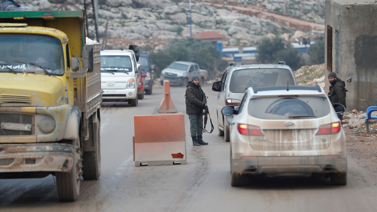 MIDEAST-CRISIS/SYRIA-TURKEY Armed men are seen at a check point in the border town of Al-Bab, near the Syrian-Turkish border, in Idlib province, Syria January 17, 2018. Picture taken January 17, 2018. REUTERS/Osman Orsal - RC1530487E20