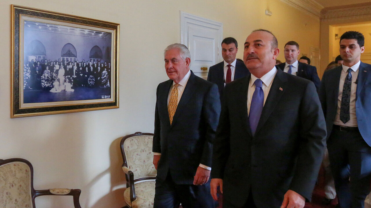 USA-TILLERSON/TURKEY Turkish Foreign Minister Mevlut Cavusoglu and U.S. Secretary of State Rex Tillerson arrive to a meeting in Ankara, Turkey, February 16, 2018. REUTERS/Cem Ozdel/Pool - RC1EECDD07D0