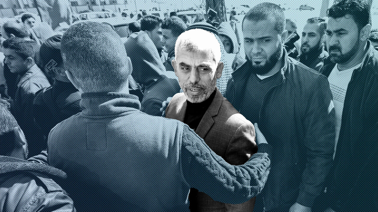 Yahya Sinwar (C), the new leader of Hamas in the Gaza Strip, arrives for the opening of a new mosque in Rafah town in the southern Gaza Strip on February 24, 2017. / AFP / SAID KHATIB        (Photo credit should read SAID KHATIB/AFP/Getty Images)