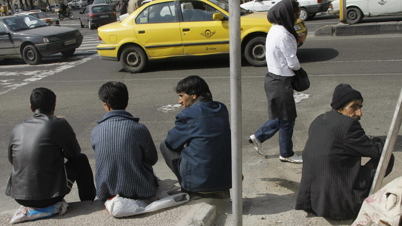 Nic245688 TO GO WITH AFP STORY BY ARESU EQBALI Iranian temporary manual workers wait for work in Tehran on March 11, 2008. High inflation, unemployment, slack monetary policy and a lack of foreign investment: Iran is suffering from a litany of economic problems ahead of legislative elections on March 14. But despite windfall revenues from high oil prices, this has yet to be felt by millions of low and middle-earners who are finding their real incomes dwindling further due to inflation that has reached 17.8 percent.