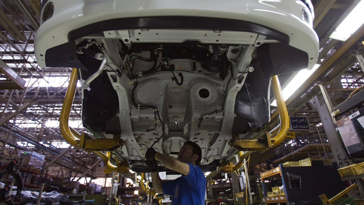 IRAN/ EDITORS' NOTE: Reuters and other foreign media are subject to Iranian restrictions on their ability to film or take pictures in Tehran.
A worker assembles a vehicle at a production line of carmaker Iran Khodro, west of Tehran June 20, 2011. Iran Khodro, Iran's biggest car maker which runs what it says is the largest car factory in the Middle East, sees sales rising at home and abroad, despite economic sanctions on the Islamic Republic. REUTERS/Morteza Nikoubazl (IRAN - Tags: TRANSPORT BUSINESS) - GM1E76K1