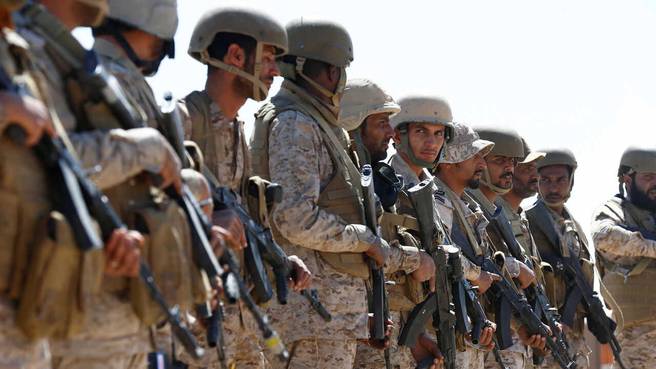 YEMEN-SECURITY/ Saudi soldiers stand in line at an airfield where Saudi military cargo planes land to deliver aid in Marib, Yemen January 26, 2018. Picture taken January 26, 2018. REUTERS/Faisal Al Nasser - RC1D0C8D9D00