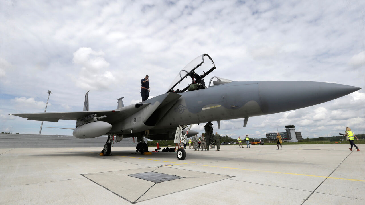 LATVIA-NATO/ A specialist inspects a U.S Air Force F-15 Eagle fighter after a certification of the arresting gear in the military air base in Lielvarde, Latvia, May 19, 2016. REUTERS/Ints Kalnins - D1AETEYRKSAA
