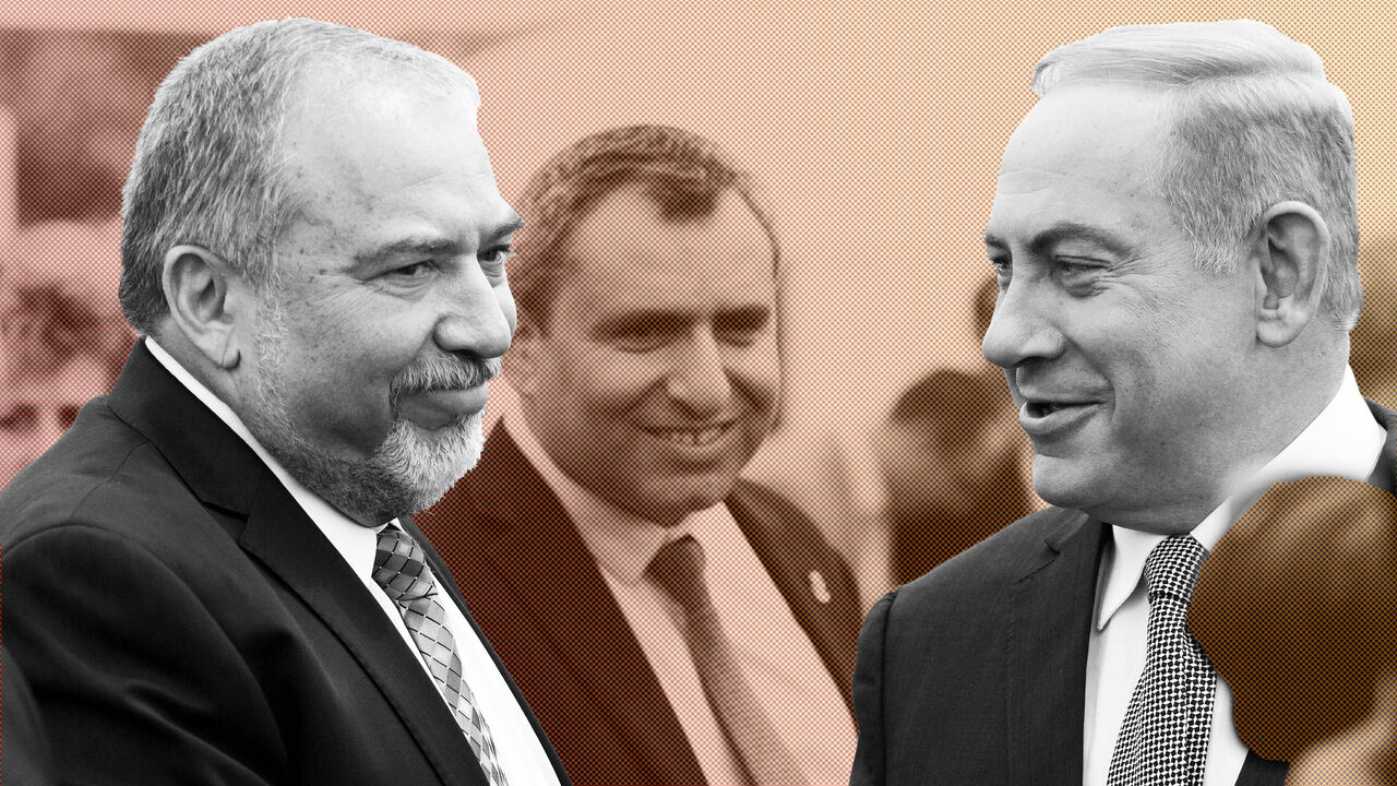 ISRAELpPOLITICS/ Israeli Prime Minister Benjamin Netanyahu (R) and Israel's defense minister, Avigdor Lieberman (L) during a special Cabinet meeting to mark Jerusalem Day in 1Ein Lavan Spring located in the outskirts of Jerusalem 02 June 2016. REUTERS/Abir Sultan/Pool - S1AETHOLEQAC