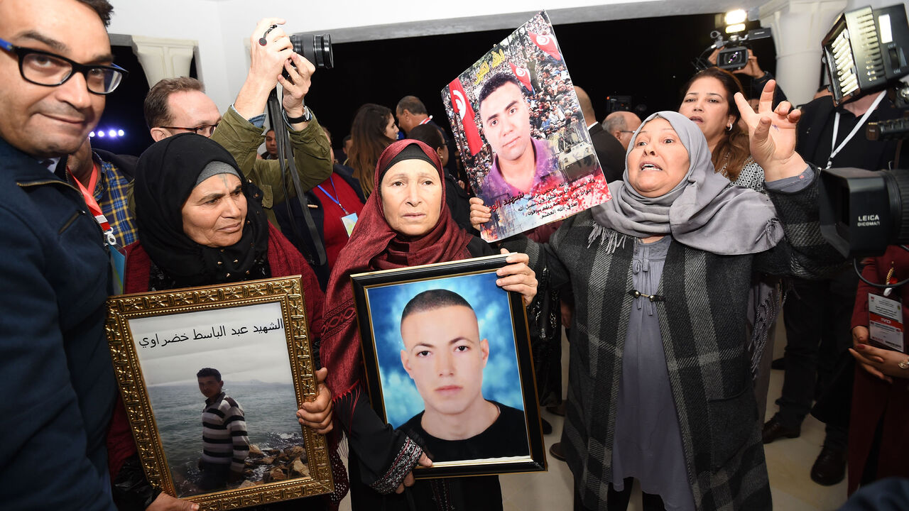 Tunisian mothers of a torture victims carry their sons' portraits as they arrive for a hearing before the The Truth and Dignity Commission (IVD) in Tunis on November 17, 2016.
Victims of murder, rape and torture under successive dictatorships started testifying on live television Thursday as Tunisia -- in a rare move for the Arab world -- tries to deal with decades of abuse.

The Truth and Dignity Commission (IVD) has tracked human rights violations committed between July 1955, a year before Tunisia gained 