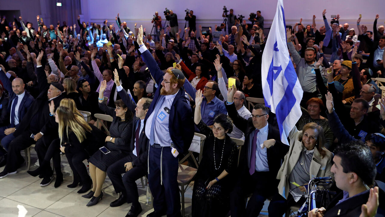 ISRAEL-PALESTINIANS/LIKUD Likud party members vote during a Likud Central Committee meeting in Airport City, Israel December 31, 2017. REUTERS/Amir Cohen - RC15A92D2000