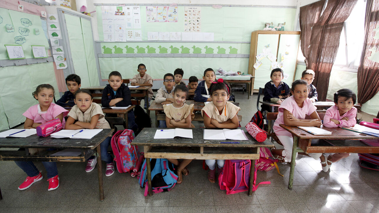 EDUCATION-GLOBAL/ Students cross their arms to demonstrate they are listening carefully to their teacher at Al Hakim El Kassar Primary School in Tunis, Tunisia, September 16, 2015. Schools have reopened, with around 2 million pupils heading back to classrooms after a three-month summer break. Nearly three years after Taliban gunmen shot Pakistani schoolgirl Malala Yousafzai, the teenage activist last week urged world leaders gathered in New York to help millions more children go to school. World Teachers' Day falls on 5 Octo
