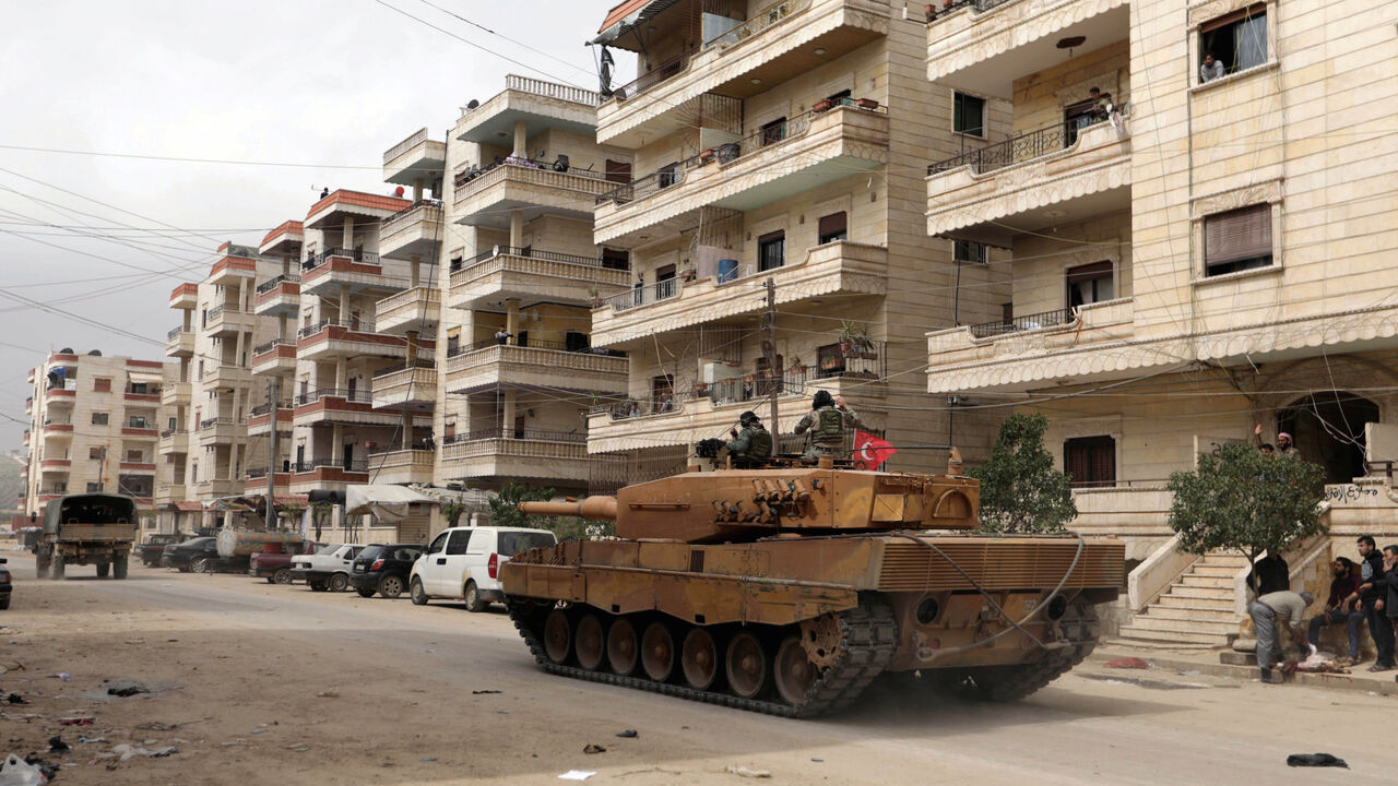 MIDEAST-CRISIS/TURKEY-AFRIN Turkish soldiers ride on a military vehicle in the center of Afrin, Syria March 24, 2018. REUTERS/Khalil Ashawi - RC1B6933DB00