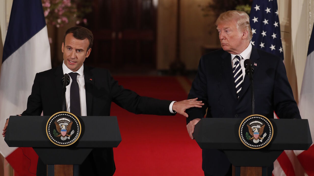 USA-FRANCE/ French President Emmanuel Macron reaches out to U.S. President Donald Trump as he speaks during their joint news conference at the White House in Washington, U.S., April 24, 2018. REUTERS/Jonathan Ernst - HP1EE4O1CL79F