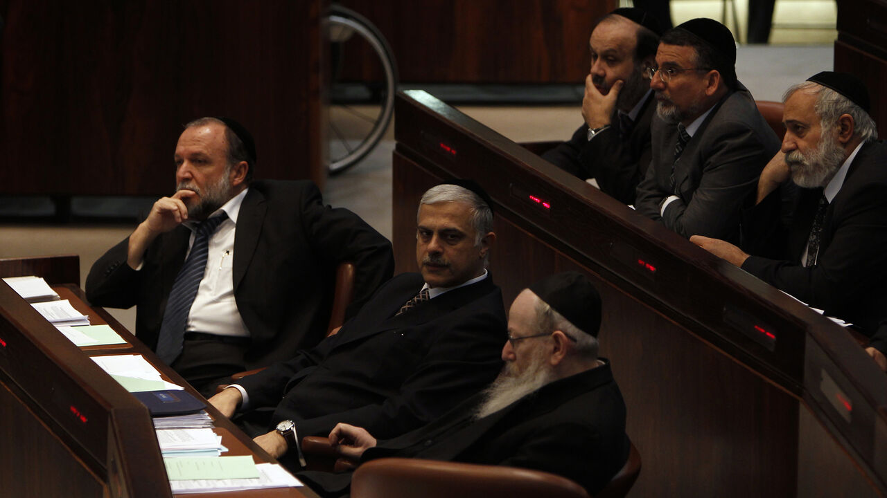 ISRAEL/ Members from Jewish religious parties attend a session of the Knesset, the Israeli parliament, in Jerusalem December 15, 2010. The session was held to debate a bill that if passed into law, would allow the state to certify the validity of all conversions to Judaism conducted by the Israeli army without the Chief Rabbinate's approval. The bill passed its preliminary reading on Wednesday. The political debate over the legislation underscored divisions on religious issues within Prime Minister Benjamin Netanya