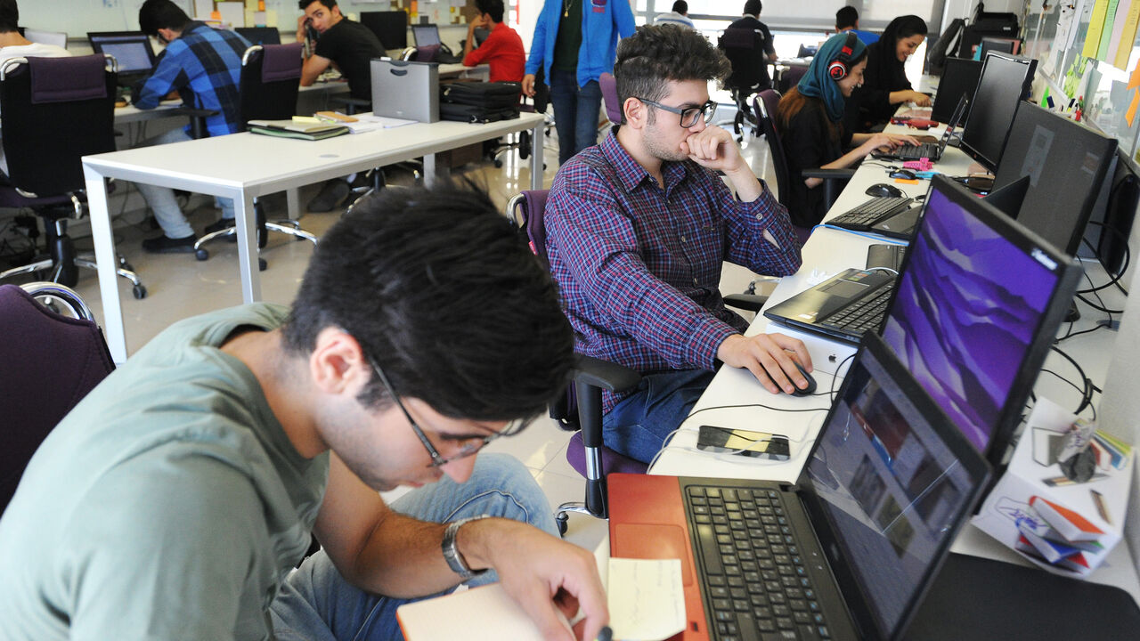 86365558 TEHRAN, IRAN - JULY 12: Young Iranian high-tech and start-up specialists work their computers at Sarava, a local venture capital firm that invests in start-ups at Pardis Technology Park, 15 miles east of Tehran, Iran, on July 12, 2015. After the Iran nuclear deal was signed on July 14 that will lift sanctions in exchange for capping Iran's nuclear program, Iranian companies are preparing to return to global financial and trade networks, and expect billions of dollars in investments. President Hassan Rouhani