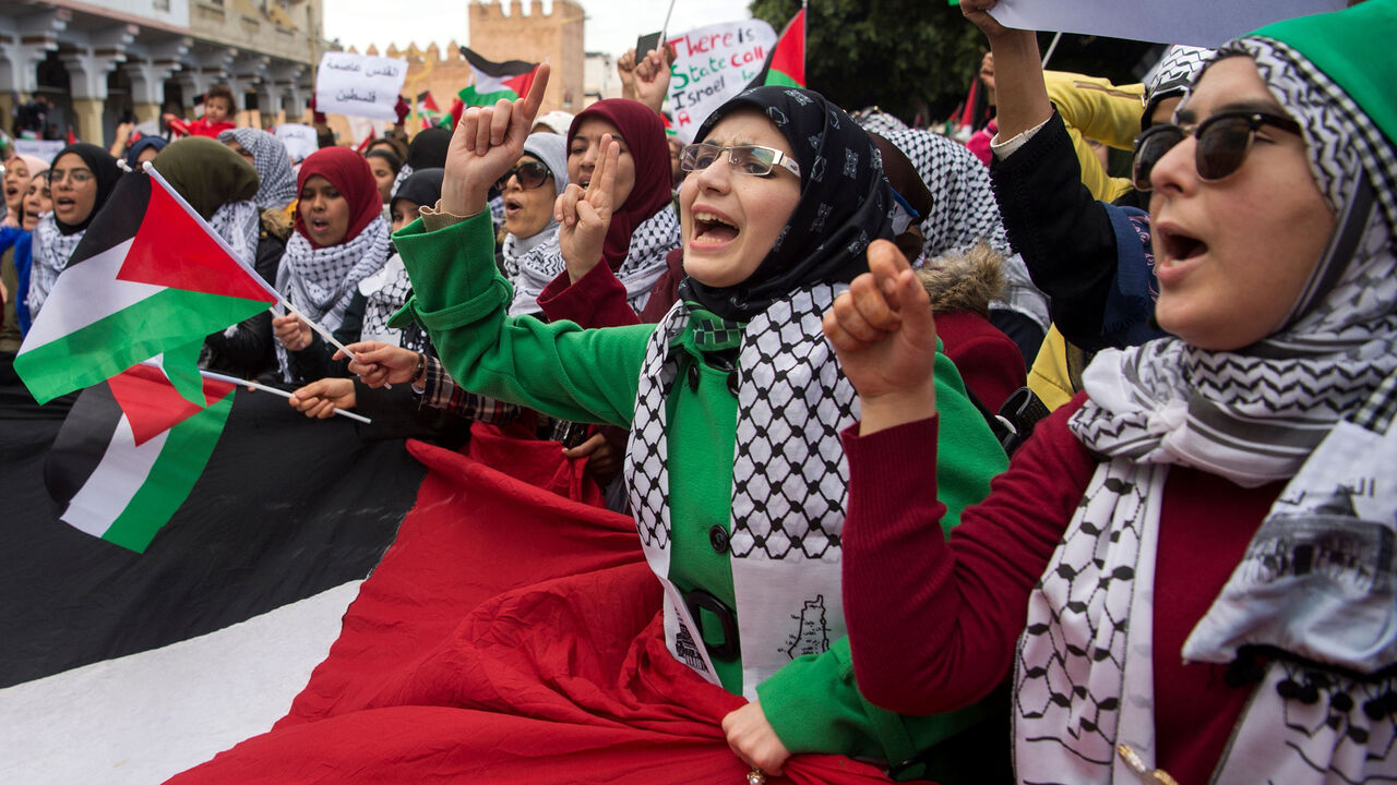AFP_V161A Pro-Palestinian protesters wave Palestinian flags and chant slogans against the US and Israel on December 10, 2017 during a demonstration in Rabat against US President Donald Trump's declaration of Jerusalem as Israel's capital. / AFP PHOTO / FADEL SENNA (Photo credit should read FADEL SENNA/AFP/Getty Images)