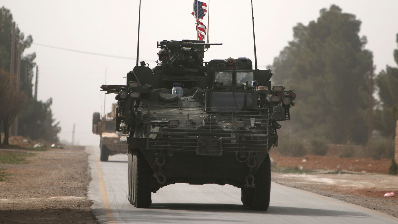 MIDEAST-CRISIS/SYRIA American army vehicles drive north of Manbij city, in Aleppo Governorate, Syria March 9, 2017. REUTERS/Rodi Said - RC1D16A42820
