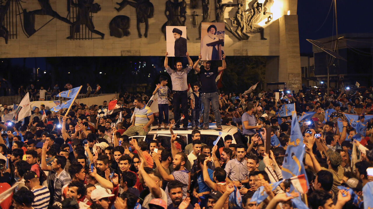 IRAQ-ELECTION/ Iraqi supporters of Sairun list celebrate after results of Iraq's parliamentary election were announced in Baghdad, Iraq May 14, 2018. REUTERS/Thaier al-Sudani - RC168748D310
