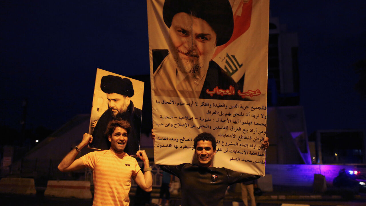 Iraqi supporters of Sairun list celebrate with portraits of Shi'ite cleric Moqtada al-Sadr, after results of Iraq's parliamentary election were announced in Baghdad, Iraq May 14, 2018. REUTERS/Thaier al-Sudani     TPX IMAGES OF THE DAY - RC1278A66440