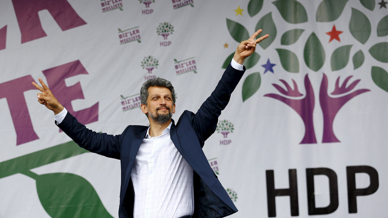 TURKEY-POLITICS/DIVERSITY Garo Paylan, newly elected Armenian lawmaker from the Pro-Kurdish Peoples' Democratic Party (HDP), greets supporters during a gathering to celebrate the party's victory during the parliamentary election, in Istanbul, Turkey, June 8, 2015. A record number of women, together with Christians, ethnic Kurds and Armenians, are set to enter Turkey's parliament after Sunday's election, a huge shift for a country that has long viewed demands for diversity as a threat to national unity. A total of 97 female lawmakers