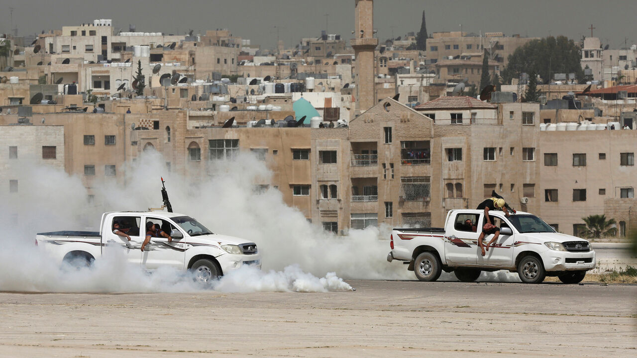 JORDAN-SECURITY/SOFEX Jordanian special forces participate in an anti-terrorism drill during the opening of the Special Operation Forces Exhibition (SOFEX) at King Abdullah II Airbase in Amman, Jordan, May 10, 2016. REUTERS/Muhammad Hamed - S1BETDGKKEAA