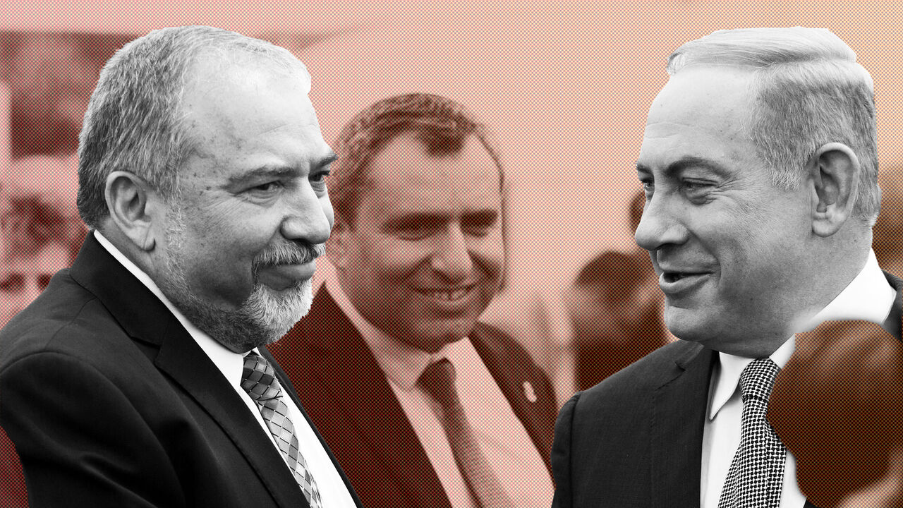 ISRAELpPOLITICS/ Israeli Prime Minister Benjamin Netanyahu (R) and Israel's defense minister, Avigdor Lieberman (L) during a special Cabinet meeting to mark Jerusalem Day in 1Ein Lavan Spring located in the outskirts of Jerusalem 02 June 2016. REUTERS/Abir Sultan/Pool - S1AETHOLEQAC