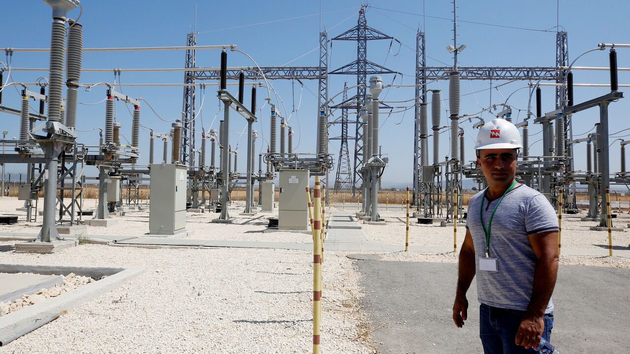 ISRAEL-PALESTINIANS/ELECTRICITY An Israeli engineer stands in the new electrical substation near the West Bank city of Jenin July 10, 2017. REUTERS/Abed Omar Qusini - RC1231051DF0