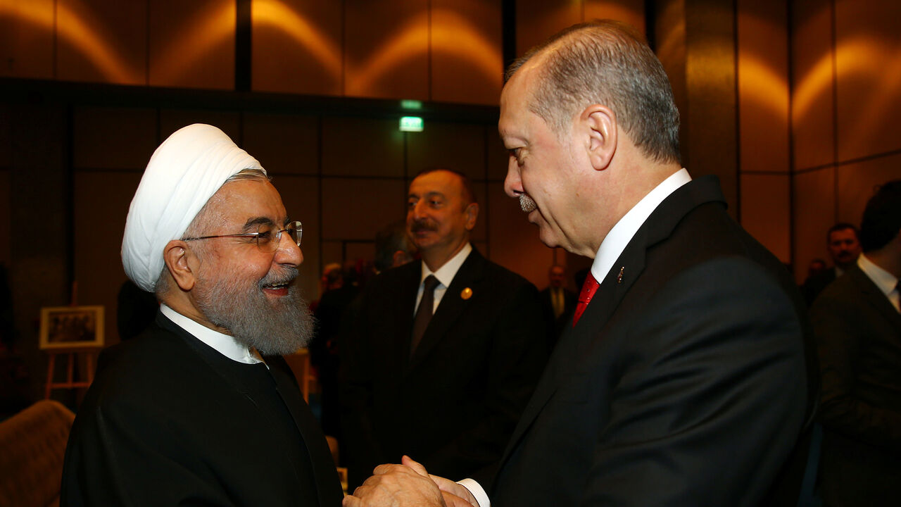 USA-TRUMP/ISRAEL-OIC Turkish President Tayyip Erdogan meets with Iran's President Hassan Rouhani during an extraordinary meeting of the Organisation of Islamic Cooperation (OIC) in Istanbul, Turkey, December 13, 2017. REUTERS/Kayhan Ozer/Pool - RC1507ABA930