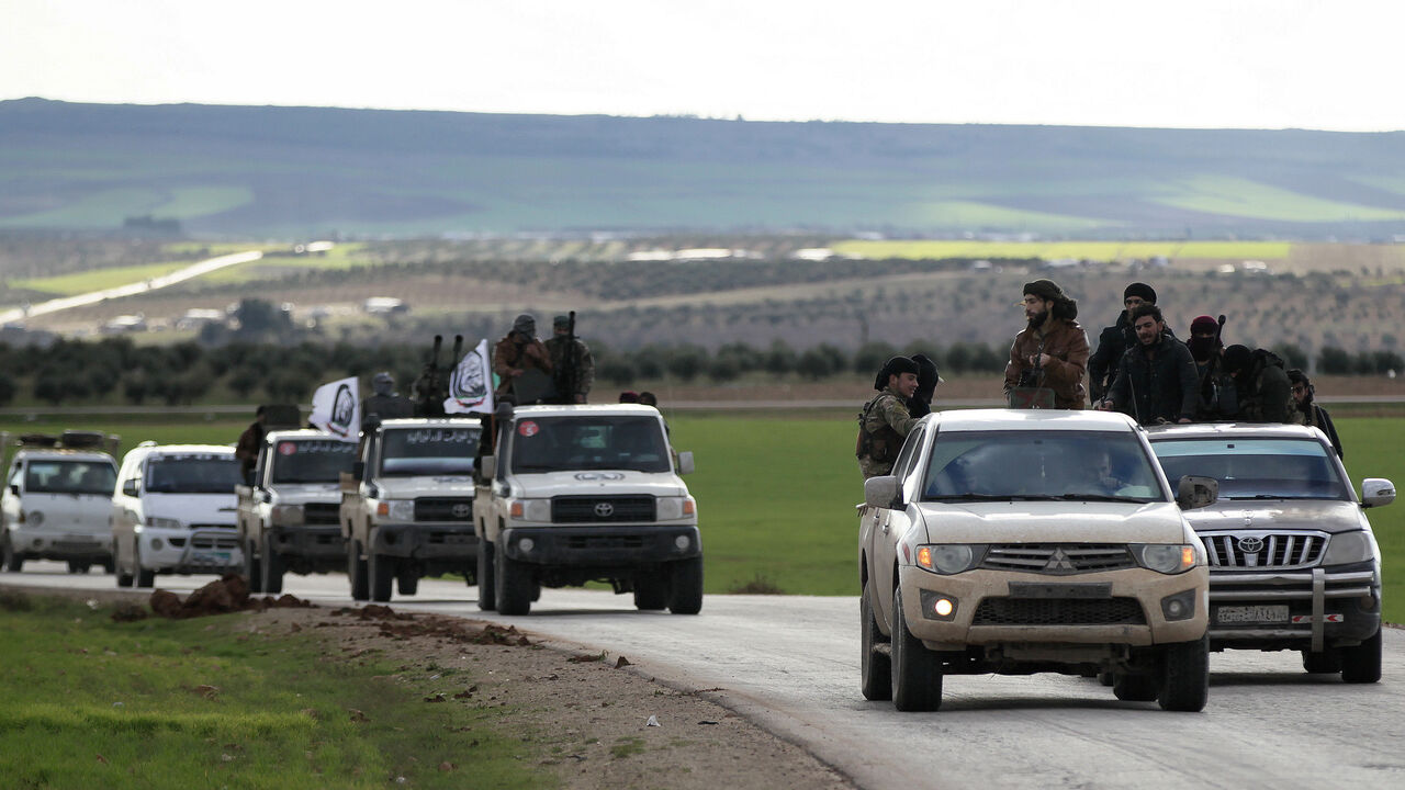 MIDEAST-CRISIS/SYRIA-YPG Turkish-backed Syrian rebels ride on trucks at Manbij countryside, Syria December 28, 2018. REUTERS/Khalil Ashawi - RC12E3699180