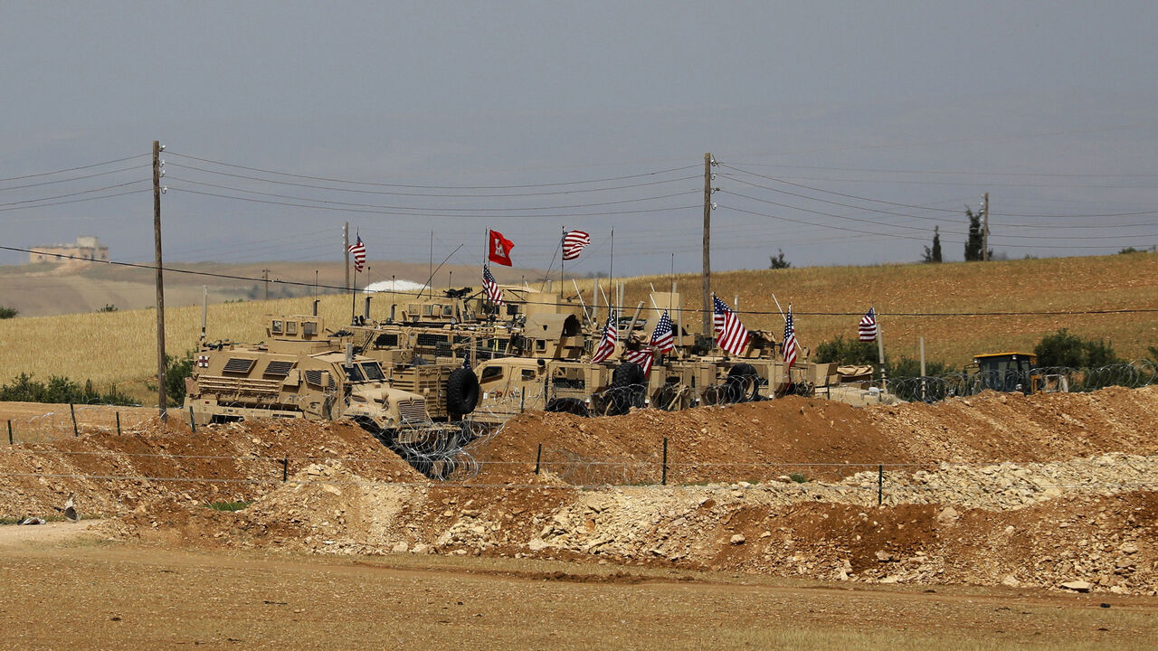AFP_14O41Z A picture taken on May 8, 2018 shows vehicles of the US-backed coalition forces in the northern Syrian town of Manbij. - The Syrian Observatory for Human Rights, a Britain-based monitor with sources on the ground, says around 350 members of the US-led coalition -- mostly American troops -- are stationed around Manbij. (Photo by Delil souleiman / AFP) (Photo credit should read DELIL SOULEIMAN/AFP/Getty Images)
