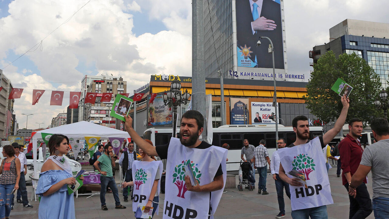 AFP_15P3UL Supporters of pro-Kurdish Peoples' Democratic Party (HDP) distribute brochures on June 7, 2018 in Ankara, ahead of the Turkish presidential elections. (Photo by ADEM ALTAN / AFP) (Photo credit should read ADEM ALTAN/AFP/Getty Images)