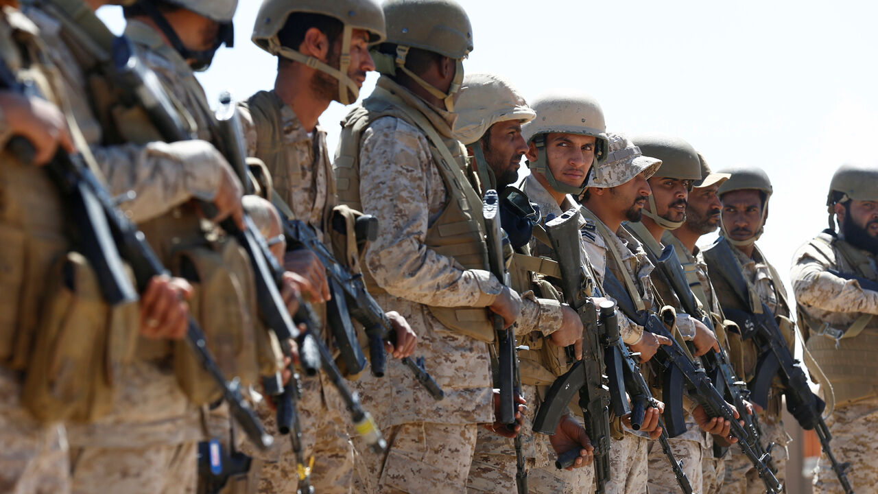 YEMEN-SECURITY/ Saudi soldiers stand in line at an airfield where Saudi military cargo planes land to deliver aid in Marib, Yemen January 26, 2018. Picture taken January 26, 2018. REUTERS/Faisal Al Nasser - RC1D0C8D9D00