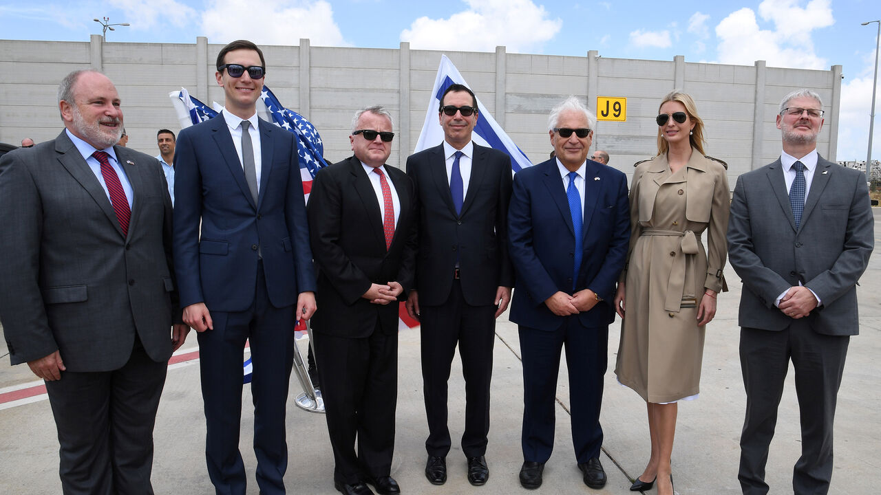 ISRAEL-USA/EMBASSY-ARRIVALS White House senior advisor Ivanka Trump (2nd-R), U.S. Ambassador to Israel David Friedman (3rd-R), U.S. Treasury Secretary Steven Mnuchin (C), U.S. Deputy Secretary of State John Sullivan (3rd-L), White House Senior Advisor Jared Kushner (2nd-L) and Israeli officials pose for a photo upon arrival at the Ben Gurion International Airport, near Lod, Israel May 13, 2018. Courtesy David Azagury/U.S. Embassy Tel Aviv/Handout via REUTERS ATTENTION EDITORS - THIS IMAGE WAS PROVIDED BY A THIRD PARTY. - RC1E15DFCD