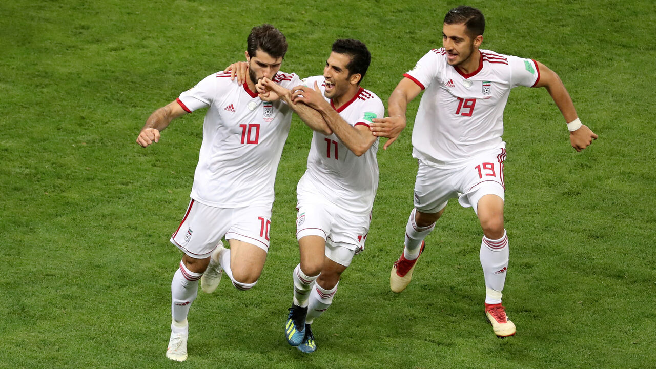 SOCCER-WORLDCUP-IRN-POR/ Soccer Football - World Cup - Group B - Iran vs Portugal - Mordovia Arena, Saransk, Russia - June 25, 2018 Iran's Karim Ansarifard celebrates scoring their first goal with Vahid Amiri and Majid Hosseini REUTERS/Lucy Nicholson TPX IMAGES OF THE DAY - RC15E3C90680