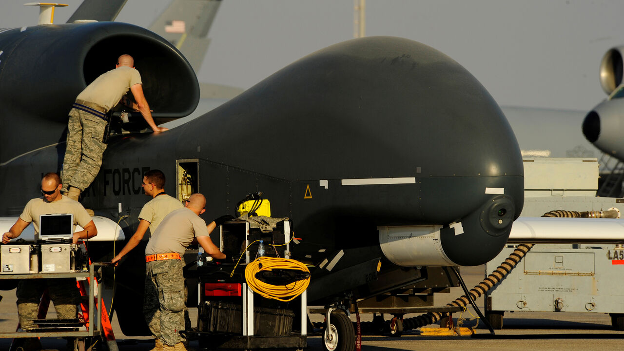 MIDEAST-IRAN/USA U.S. Air Force maintainers prepare a U.S. military drone RQ-4A Global Hawk for takeoff at an undisclosed location in Southwest Asia, December 2, 2010. Picture taken December 2, 2010. Courtesy Eric Harris/U.S. Air Force/Handout via REUTERS ATTENTION EDITORS - THIS IMAGE HAS BEEN SUPPLIED BY A THIRD PARTY. - RC17D81CAF00