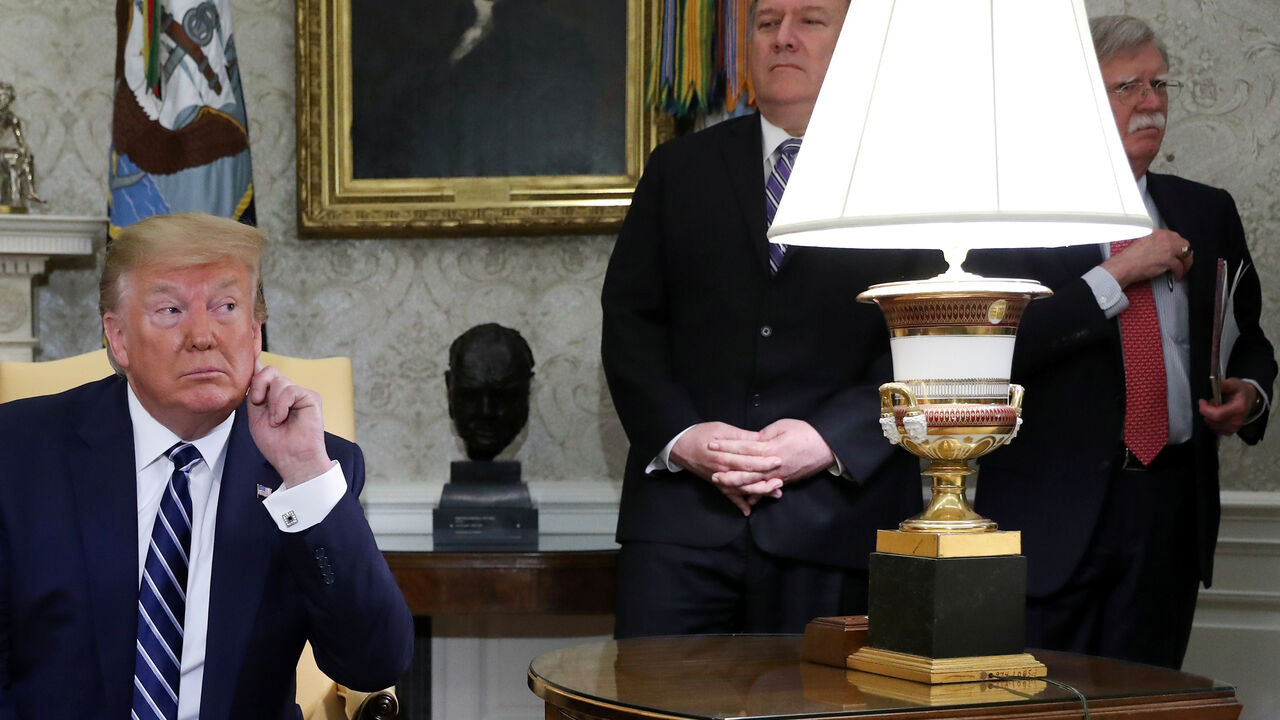 U.S. President Donald Trump listens to questions during a meeting with Canada's Prime Minister Justin Trudeau as Secretary of State Mike Pompeo and White House national security adviser John Bolton look on in the Oval Office of the White House in Washington, U.S., June 20, 2019. REUTERS/Jonathan Ernst - RC1ACBBDB270