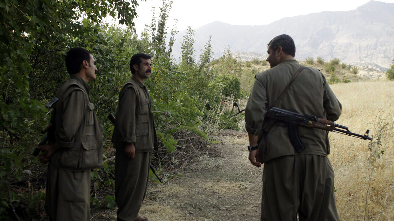 IRAQ/ Fighters from a Kurdistan Workers Party (PKK)
camp stand guard during a news conference in the remote Qandil mountains near the Iraq-Turkish border in Sulaimaniya, 330 km (205 miles) northeast of Baghdad, August 13, 2010. Picture taken August 13, 2010. REUTERS/Stringer (IRAQ - Tags: POLITICS CIVIL UNREST) - GM1E68E1OH601