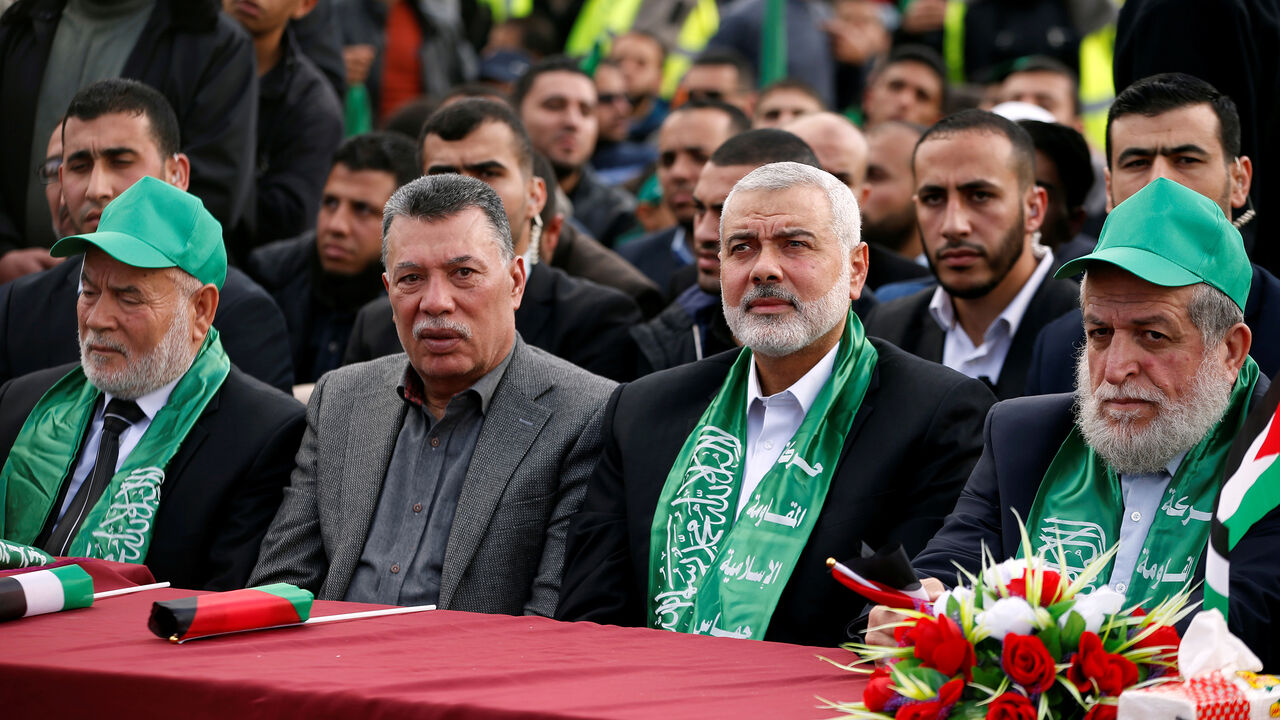 Hamas Chief Ismail Haniyeh (2nd R) attends a rally marking the 30th anniversary of Hamas' founding, in Gaza City December 14, 2017. REUTERS/Mohammed Salem - RC17C6C8A1E0