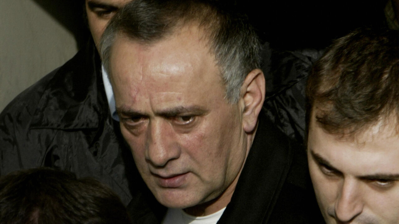 PAR2004101443227 ISTANBUL, TURKEY: Convicted Turkish mafia boss Alaattin Cakici (L), escorted by anti-terror police, arrives at Istanbul criminal court, 14 October 2004. Cakici was extradited from Austria where he was arrested in July after fleeing Turkey and faces a series of charges, including murder, media reports said. AFP PHOTO/Mustafa Ozer (Photo credit should read MUSTAFA OZER/AFP/Getty Images)