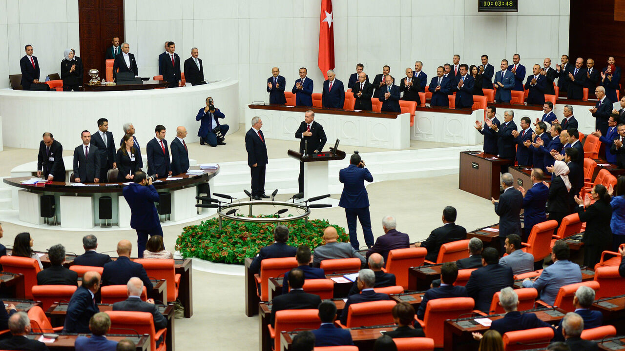 775188551 ANKARA, TURKEY - JULY 9: Turkey's President Recep Tayyip Erdogan receives his oath as he is sworns as Turkey's first Executive President at the Turkish parliament on July 9, 2018 in Ankara, Turkey. President Erdogan was sworn in during a parliamentary meeting and later an inauguration ceremony attended by a number of foreign leaders and dignitaries. President Erdogan secured another five year term and increased powers after winning 52.5 percent of the vote in the June 24 snap presidential and parliamentary