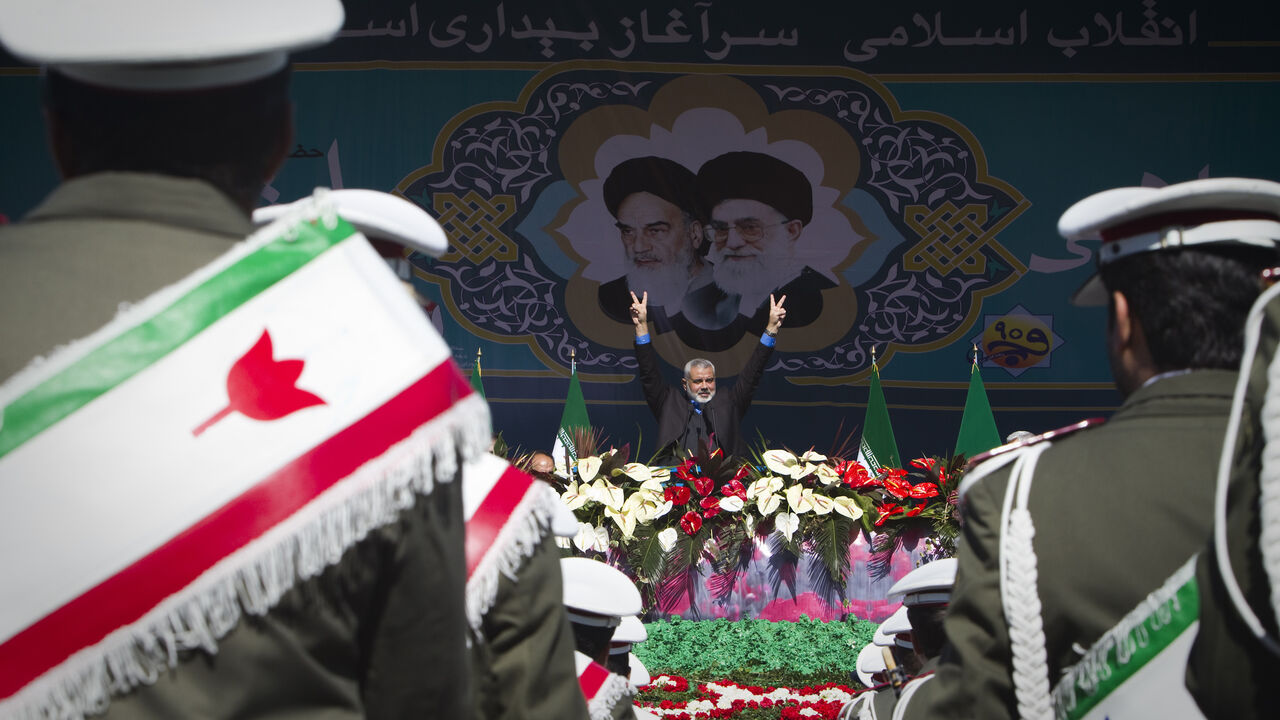 IRAN-NUCLEAR/AHMADINEJAD EDITORS' NOTE: Reuters and other foreign media are subject to Iranian restrictions on leaving the office to report, film or take pictures in Tehran.
Hamas Leader Ismail Haniyeh flashes the victory sign during a ceremony to mark the 33rd anniversary of the Islamic Revolution, in Tehran's Azadi square February 11, 2012. Iran's President Mahmoud Ahmadinejad said on the anniversary of the revolution that the Islamic Republic would soon announce "very important" REUTERS/Raheb Homavandi (IRAN - Tags: ANNIVERS