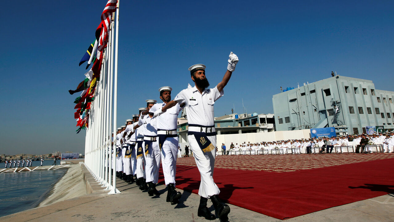 PAKISTAN-NAVY/EXERCISES Pakistan Navy's servicemen march after hoisting the national flags of participating countries during the opening ceremony of Pakistan Navyís Multinational Exercise AMAN-17, in Karachi, Pakistan February 10, 2017. REUTERS/Akhtar Soomro - RC11ADB28990