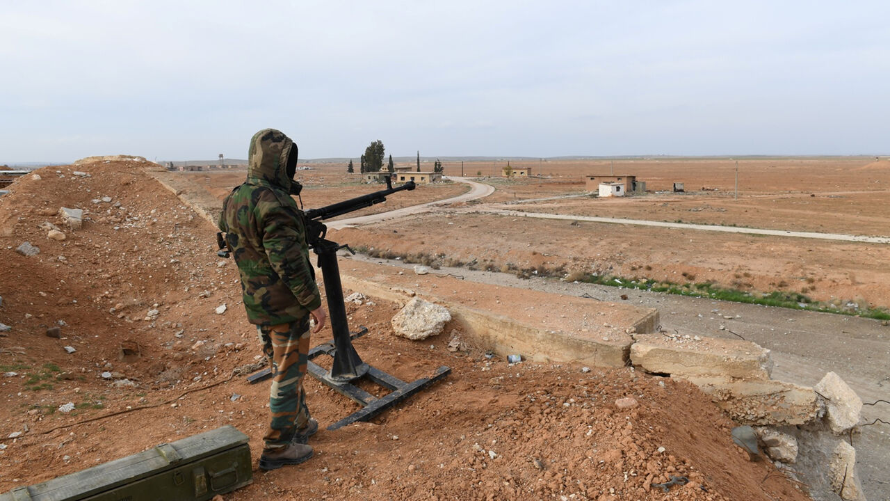 MIDEAST-CRISIS/SYRIA-AIRPORT A Syrian Army soldier loyal to Syria's President Bashar al-Assad forces stands next to a military weapon in Idlib, Syria January 21, 2018. Picture taken January 21, 2018. SANA/Handout via REUTERS ATTENTION EDITORS - THIS PICTURE WAS PROVIDED BY A THIRD PARTY. REUTERS IS UNABLE TO INDEPENDENTLY VERIFY THE AUTHENTICITY, CONTENT, LOCATION OR DATE OF THIS IMAGE. - RC19C0D8B740