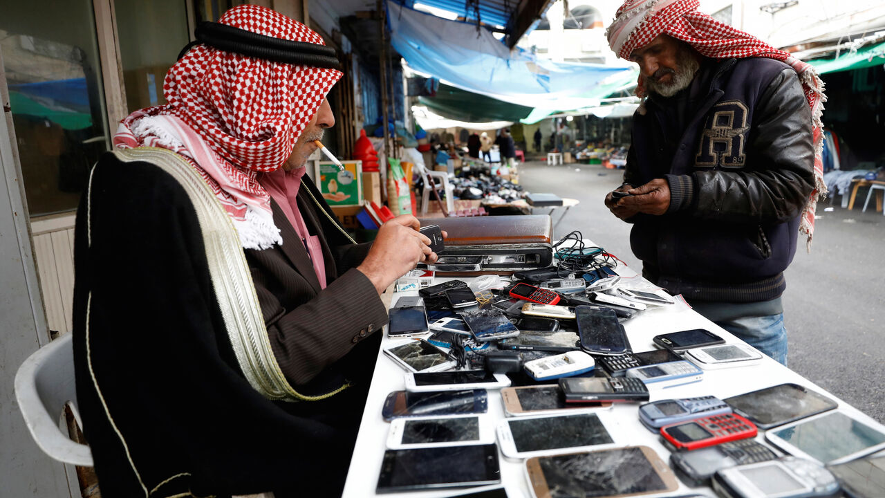 ISRAEL-PALESTINIANS/TELECOM A Palestinian man sells used mobile phones in the West Bank city of Ramallah January 24, 2018. REUTERS/Mohamad Torokman - RC11656AA640