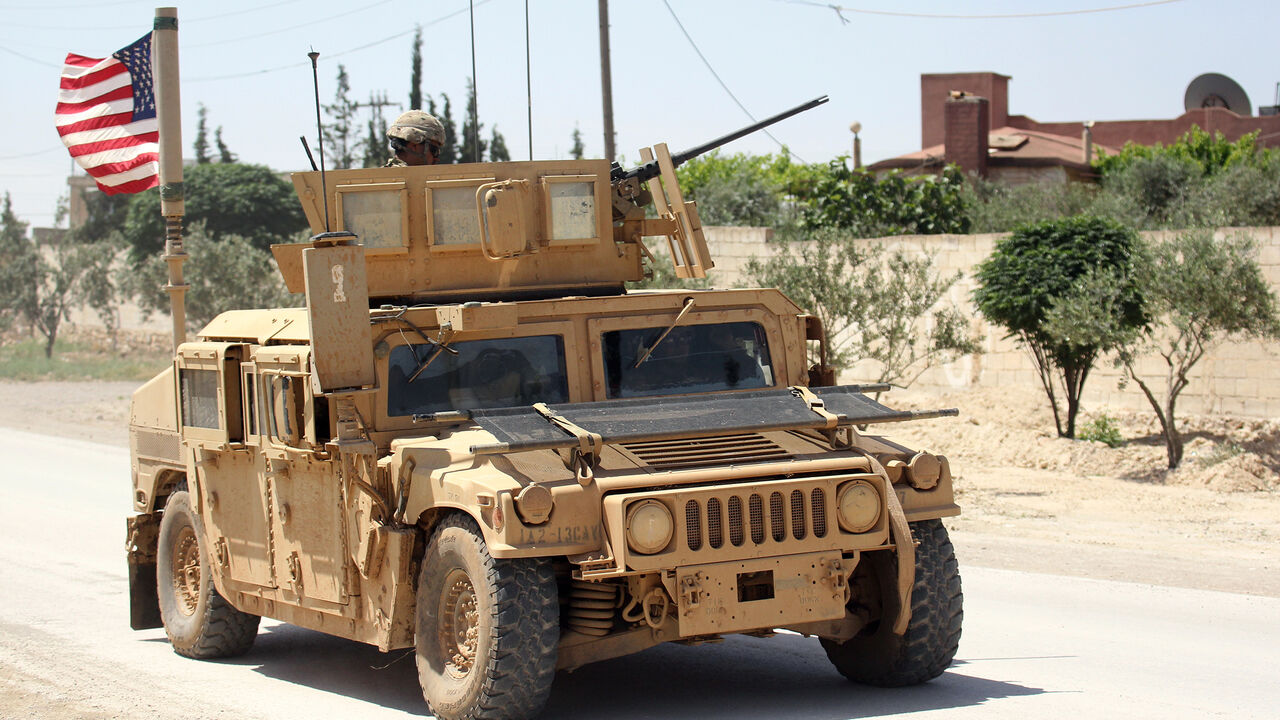 MIDEAST-CRISIS/SYRIA The U.S. flag flutters on a military vehicle in Manbej countryside, Syria May 12, 2018. REUTERS/Aboud Hamam - RC11141AD840