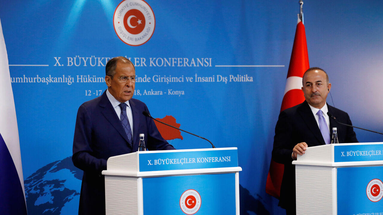 MIDEAST-CRISIS/SYRIA-TURKEY-RUSSIA Russian Foreign Minister Sergei Lavrov and his Turkish counterpart Mevlut Cavusoglu attend a news conference in Ankara, Turkey, August 14, 2018. REUTERS/Umit Bektas - RC14B67E5FF0