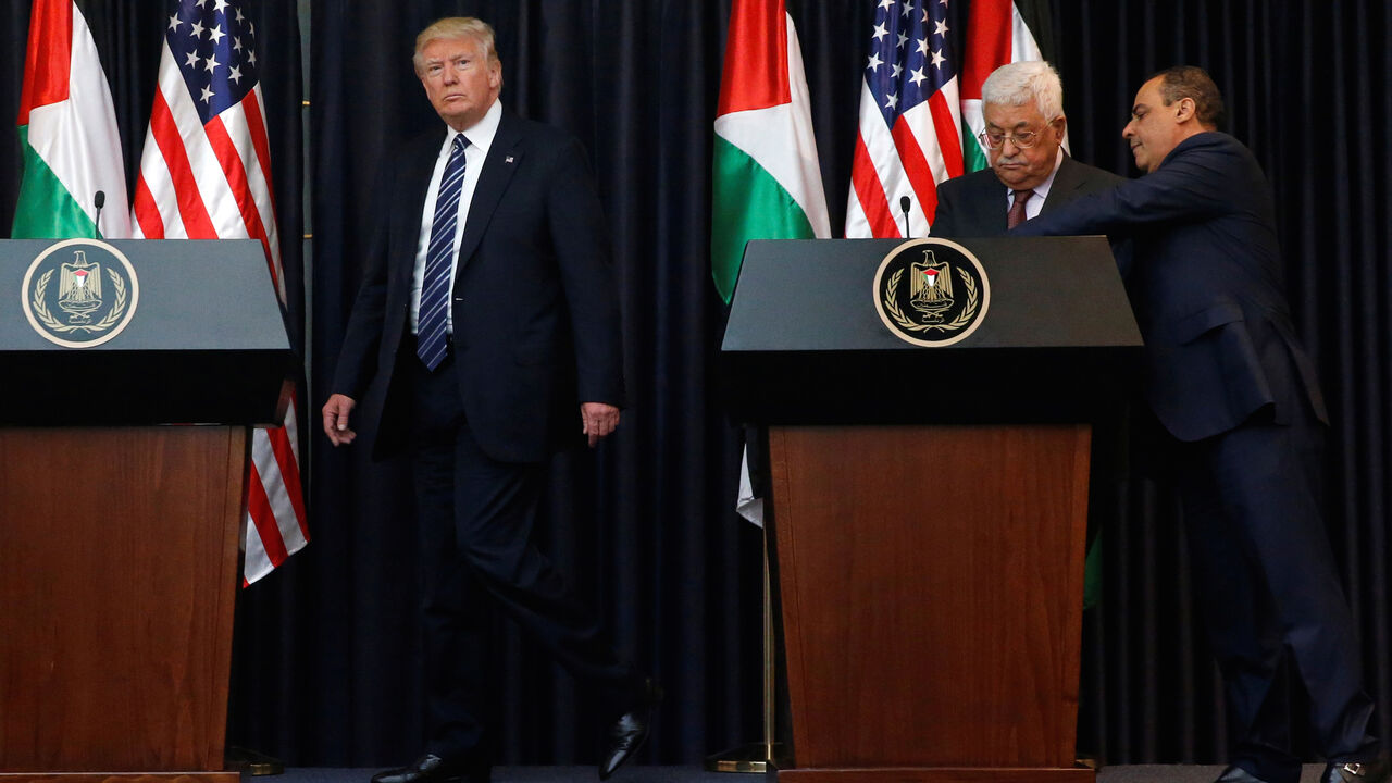 USA-TRUMP/PALESTINIANS U.S. President Donald Trump (L) and Palestinian President Mahmoud Abbas (2nd R) arrive to deliver remarks after their meeting at the Presidential Palace in the West Bank city of Bethlehem May 23, 2017. REUTERS/Jonathan Ernst - RC1ACE895740