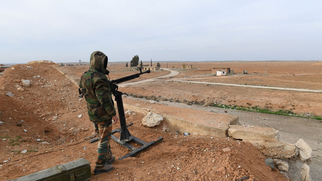 MIDEAST-CRISIS/SYRIA-AIRPORT A Syrian Army soldier loyal to Syria's President Bashar al-Assad forces stands next to a military weapon in Idlib, Syria January 21, 2018. Picture taken January 21, 2018. SANA/Handout via REUTERS ATTENTION EDITORS - THIS PICTURE WAS PROVIDED BY A THIRD PARTY. REUTERS IS UNABLE TO INDEPENDENTLY VERIFY THE AUTHENTICITY, CONTENT, LOCATION OR DATE OF THIS IMAGE. - RC19C0D8B740