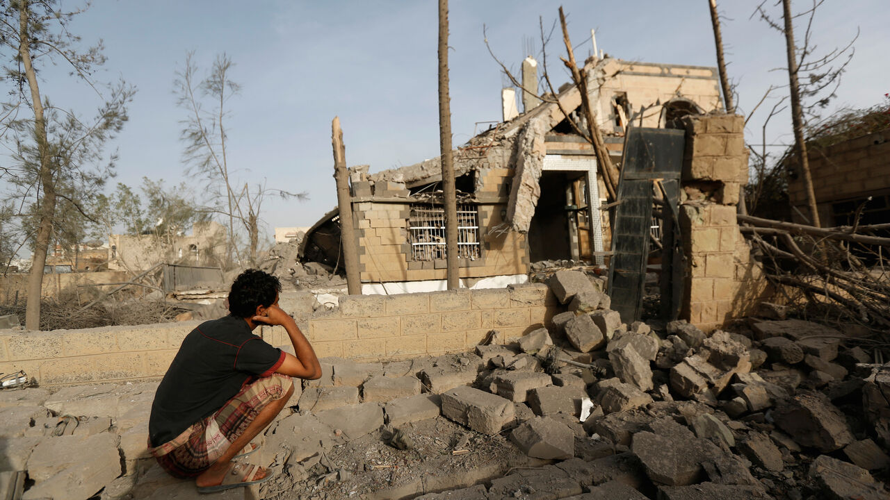 YEMEN-SECURITY/ A man sits in front of a house destroyed by air strikes in Sanaa, Yemen June 6, 2018. REUTERS/Khaled Abdullah - RC1182083EA0