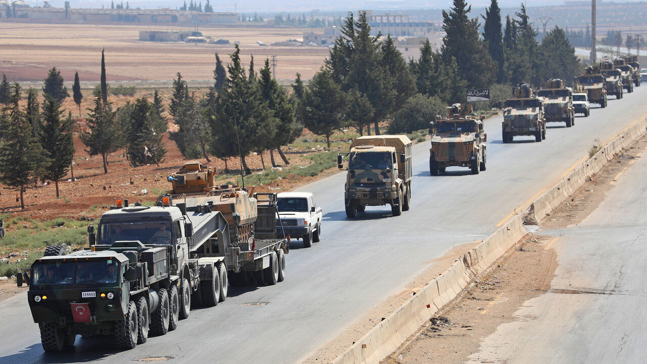 AFP_18O94F Turkish forces are seen in a convoy on a main highway between Damascus and Aleppo, near the town of Saraqib in Syria's northern Idlib province, on August 29, 2018. - Russian Foreign Minister Sergei Lavrov said in a press conference today that there is "full political understanding" between Russia and Turkey, who support opposing sides of the Syrian civil war but are currently in intense negotiations to ensure Idlib does not become a breaking point in their alliance. (Photo by OMAR HAJ KADOUR / AFP) (
