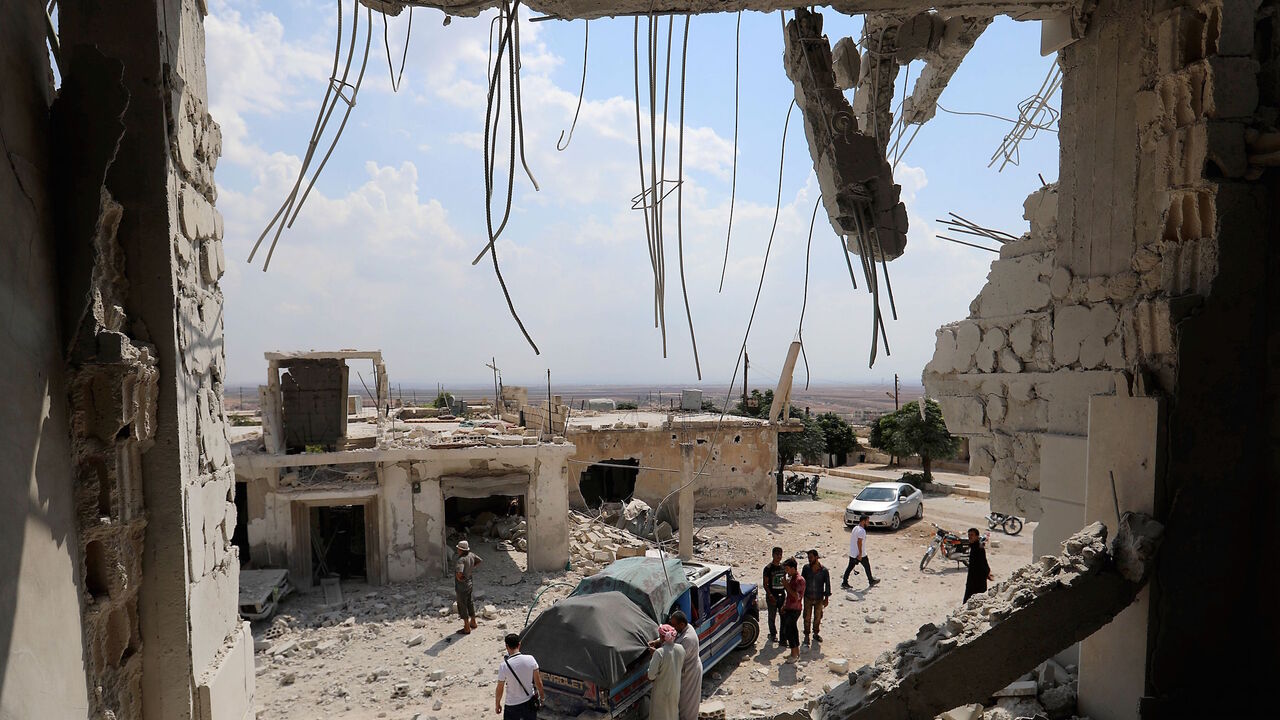 AFP_18Y9RV TOPSHOT - This picture shows the destructions after govenrment forces' bombings in the town of Al Habit on the southern edges of the rebel-held Idlib province on September 9, 2018. - Russian air strikes on Syria's last major rebel bastion today were the "most violent" in a month since Damascus and its ally Moscow started threatening it with an imminent attack around a month ago, a monitor said. (Photo by OMAR HAJ KADOUR / AFP) (Photo credit should read OMAR HAJ KADOUR/AFP/Getty Images)